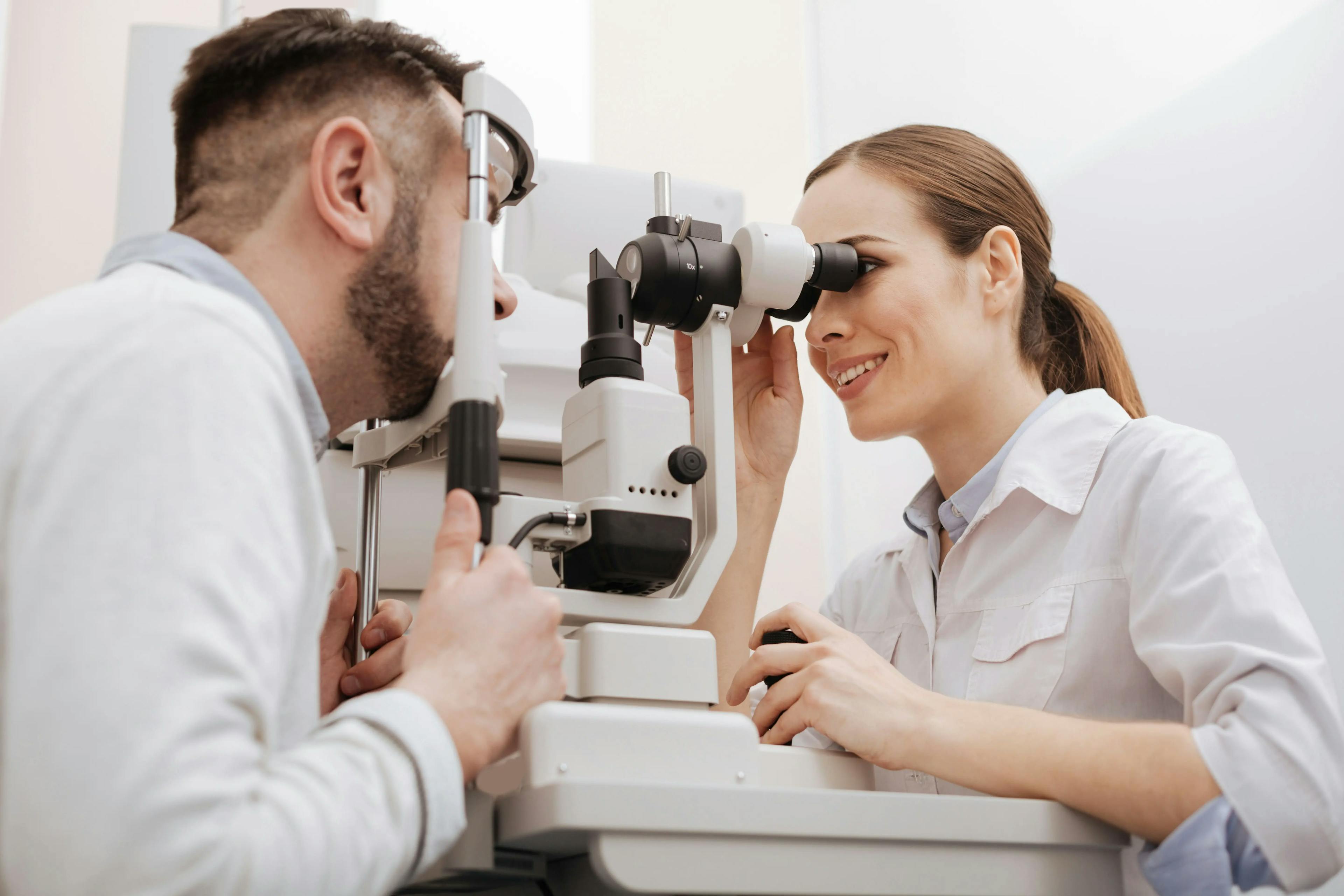 female optometrist conducting eye exam
